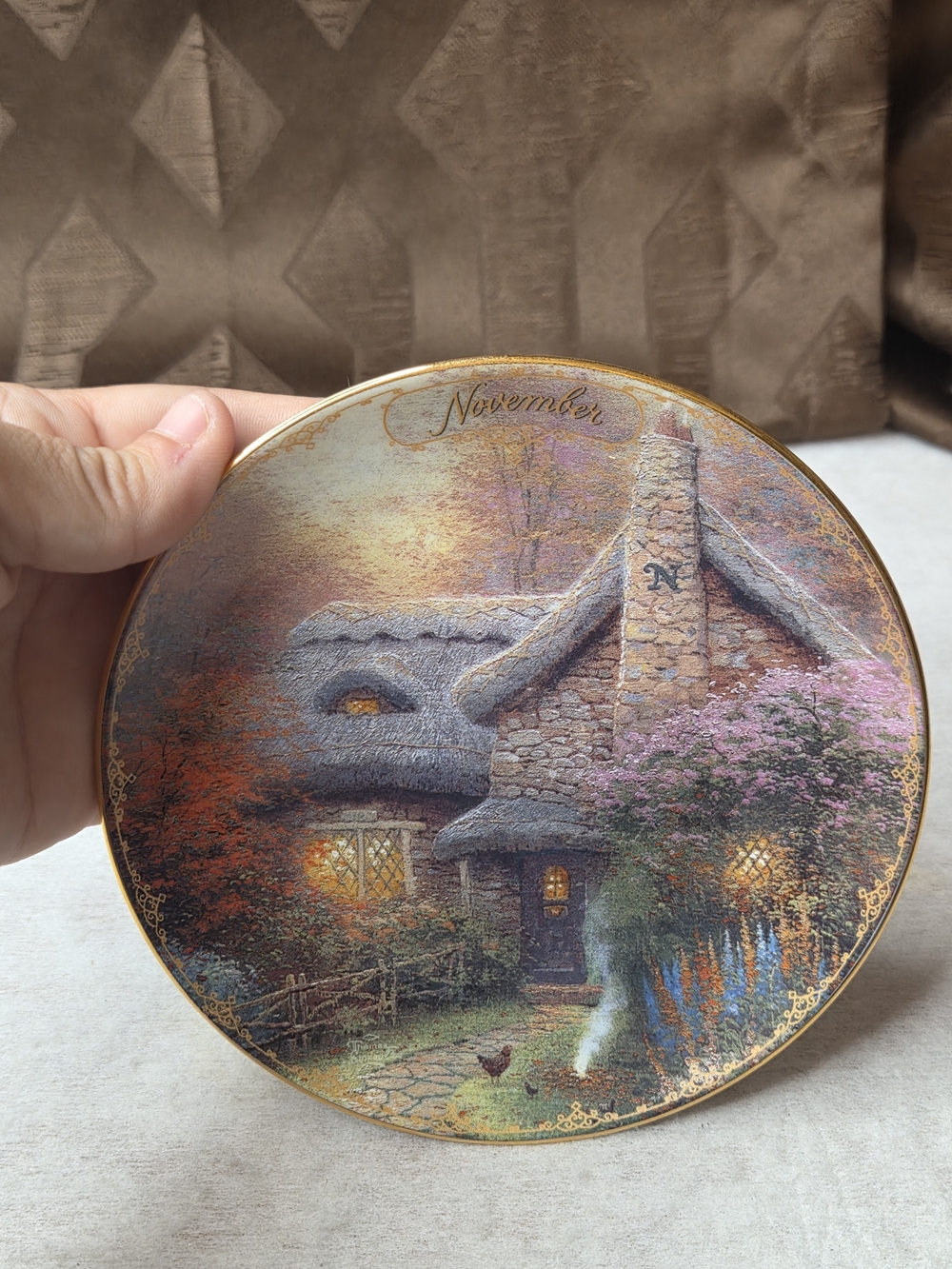 Thomas Kinkade November Cottage Plate — brown, green, purple, orange, blue